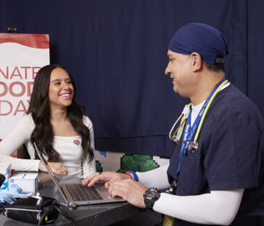 Blood donor asking questions about the donation process with a CBC doctor.